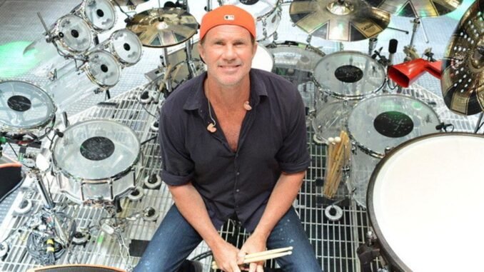 chad-smith-poses-for-a-shot-amidst-instruments Chad Smith net worth