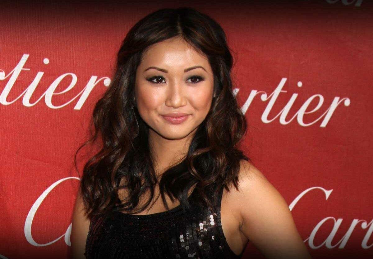 Beautiful Brenda Song smiles to the camera
