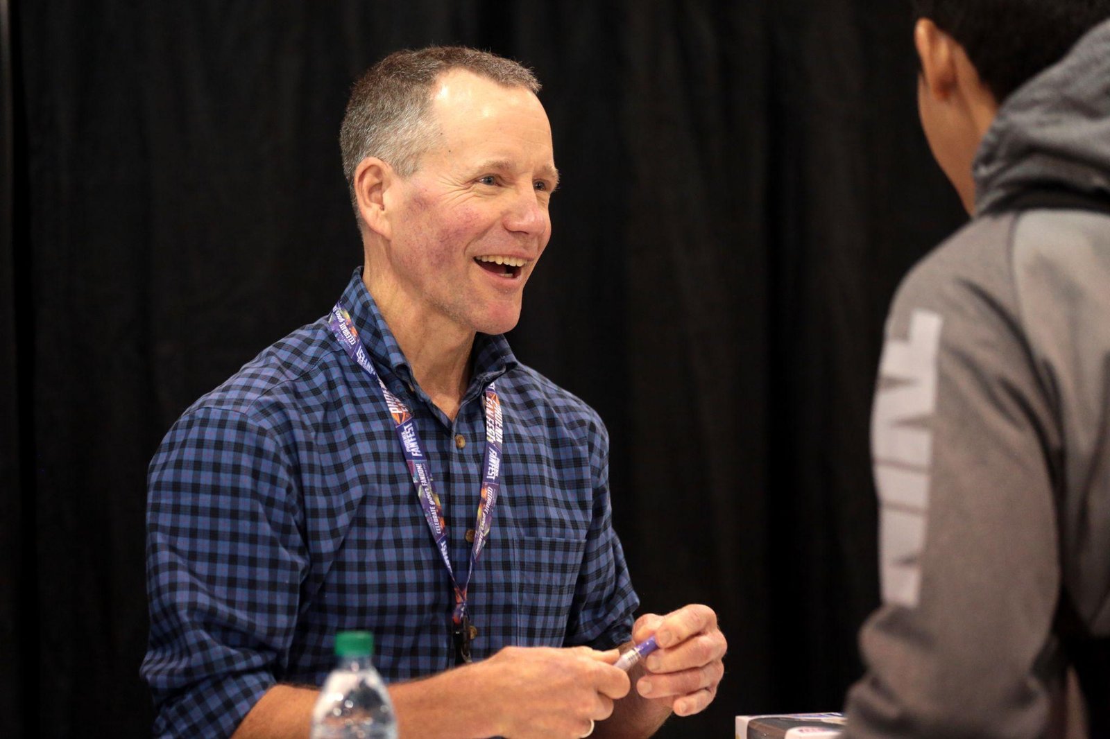 Peter Ostrum conversing with a colleague