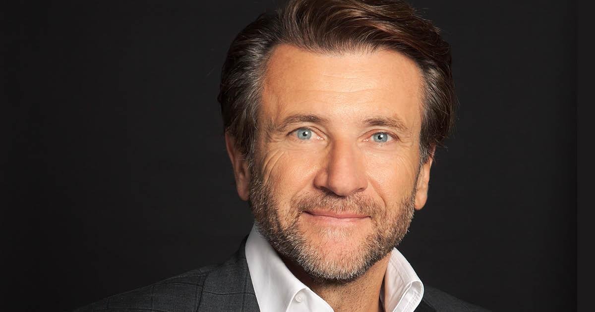 Robert Herjavec smiles to the camera